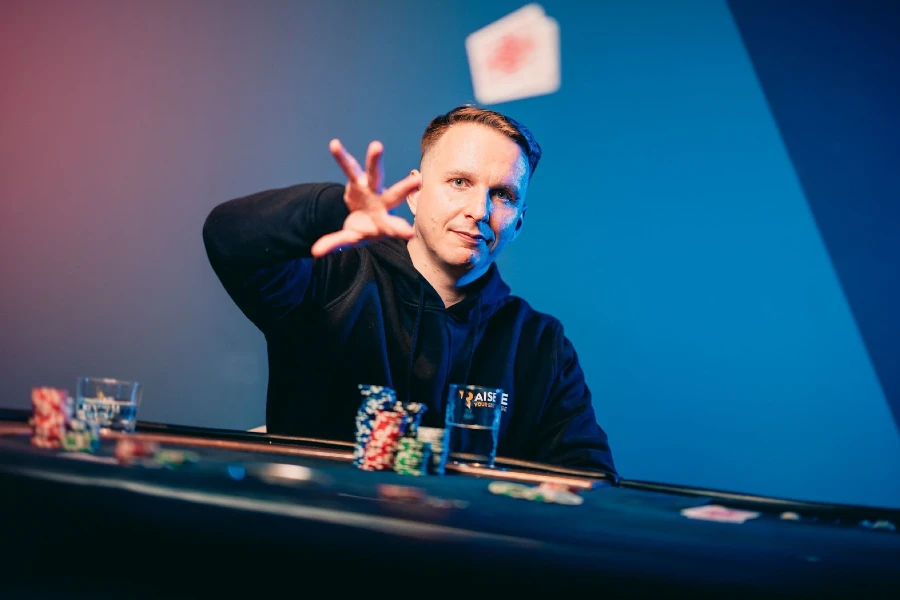 An image showing CoinPoker ambassador Benjamin Rolle, aka Bencb, at a poker table.