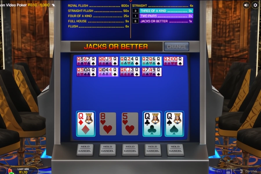 A player wins with three of a kind Queens and various other video poker hands.