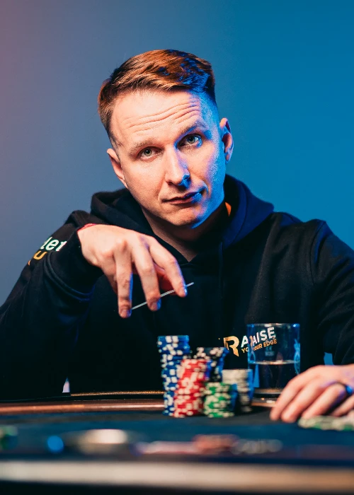 An image showing CoinPoker ambassador Benjamin Rolle, aka Bencb, at a poker table.